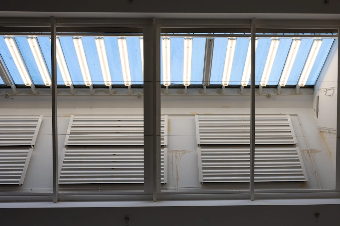 side by side retractable and fixed awnings on residential home