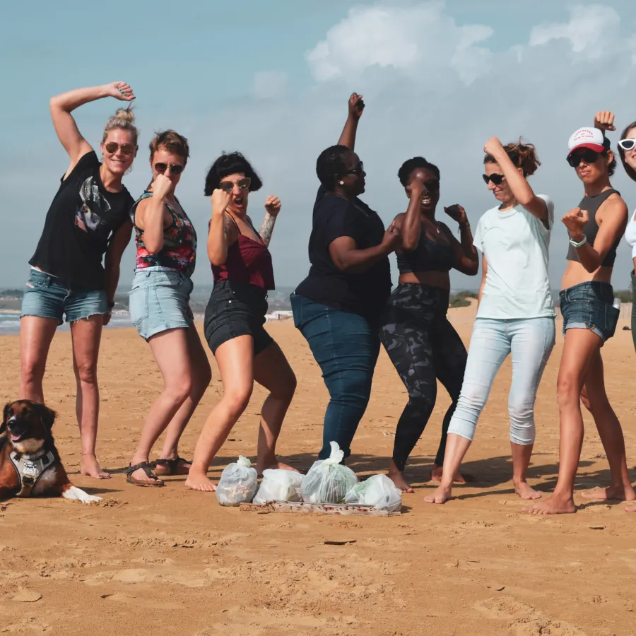 Beach cleanup group at Floripa Surf and Yoga House in Sicily promoting sustainability, community, and coastal wellbeing