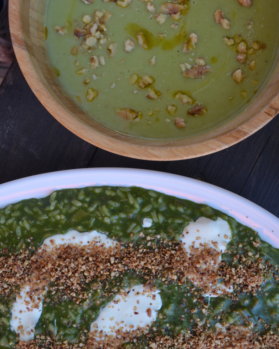 Fresh vegetarian food prepared by the in-house Italian chef at Floripa Surf and Yoga Retreat in Sicily, including spinach risotto and walnut-topped soup
