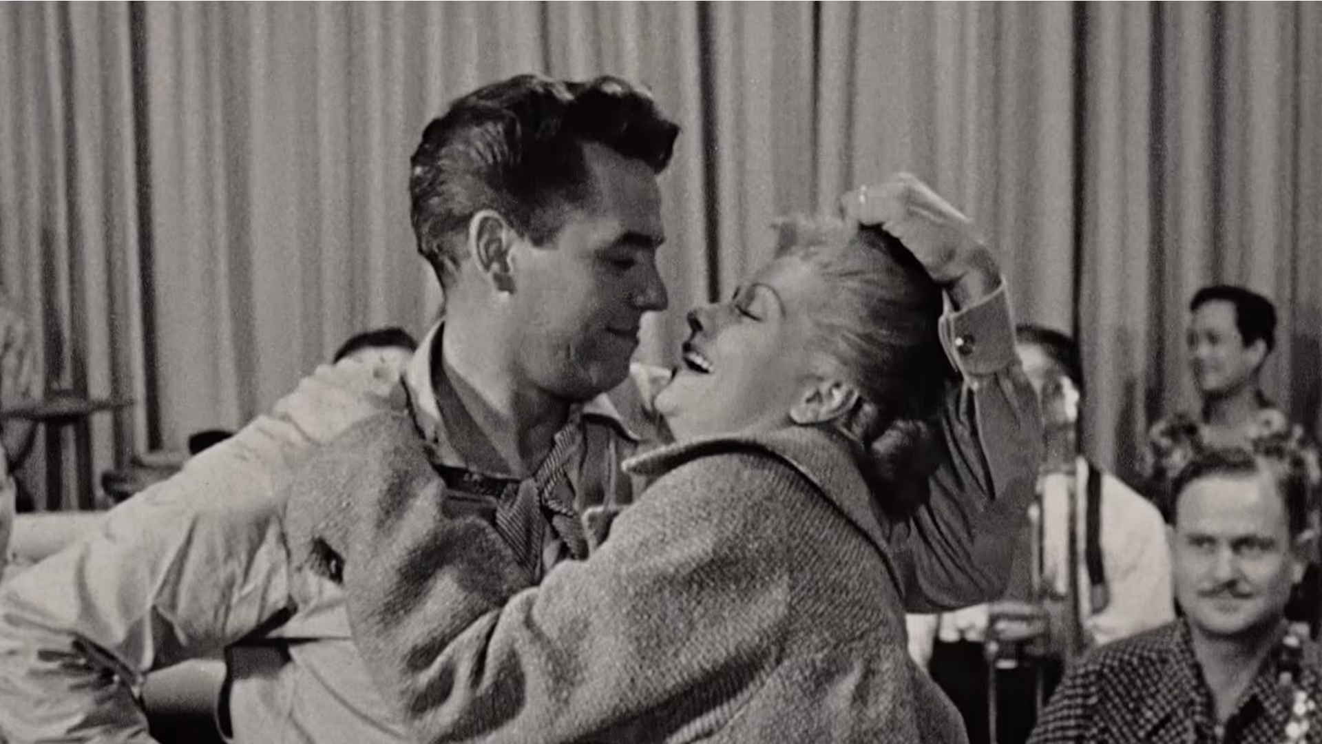 A couple dancing in black and white image