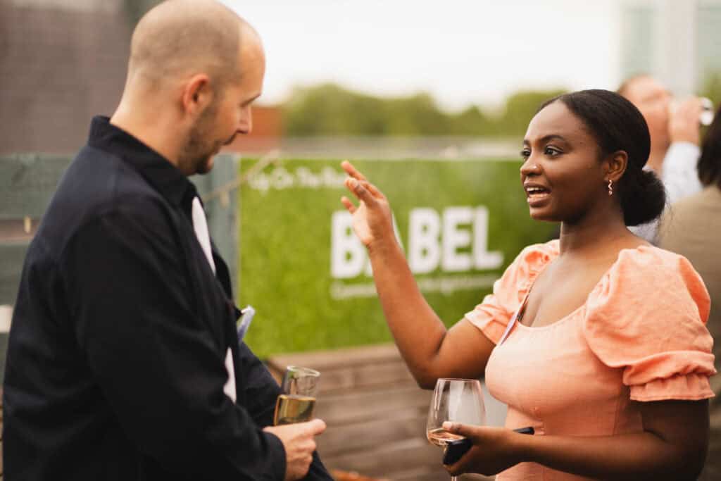 Khairat Shaaban speaking to a client at an event