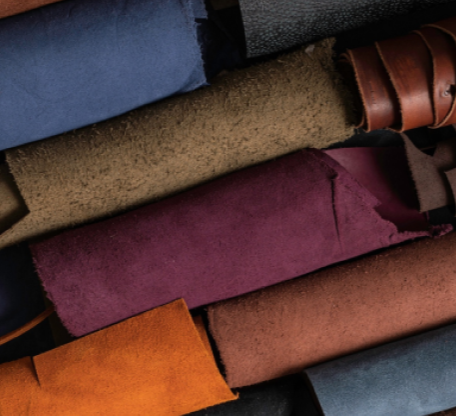 A bunch of different colored ties laid out together.