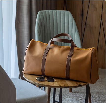 A brown bag sitting on top of a wooden table.