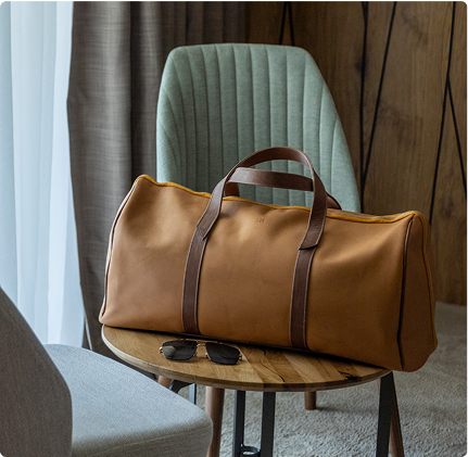 A brown bag sitting on top of a wooden table.