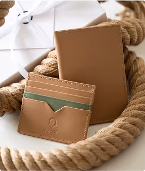 A rope with a wallet and a card case on it.