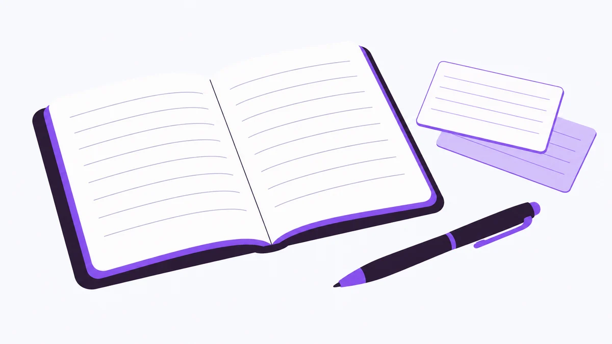Un cahier ouvert, deux cartes de révision et un stylo sur fond clair.