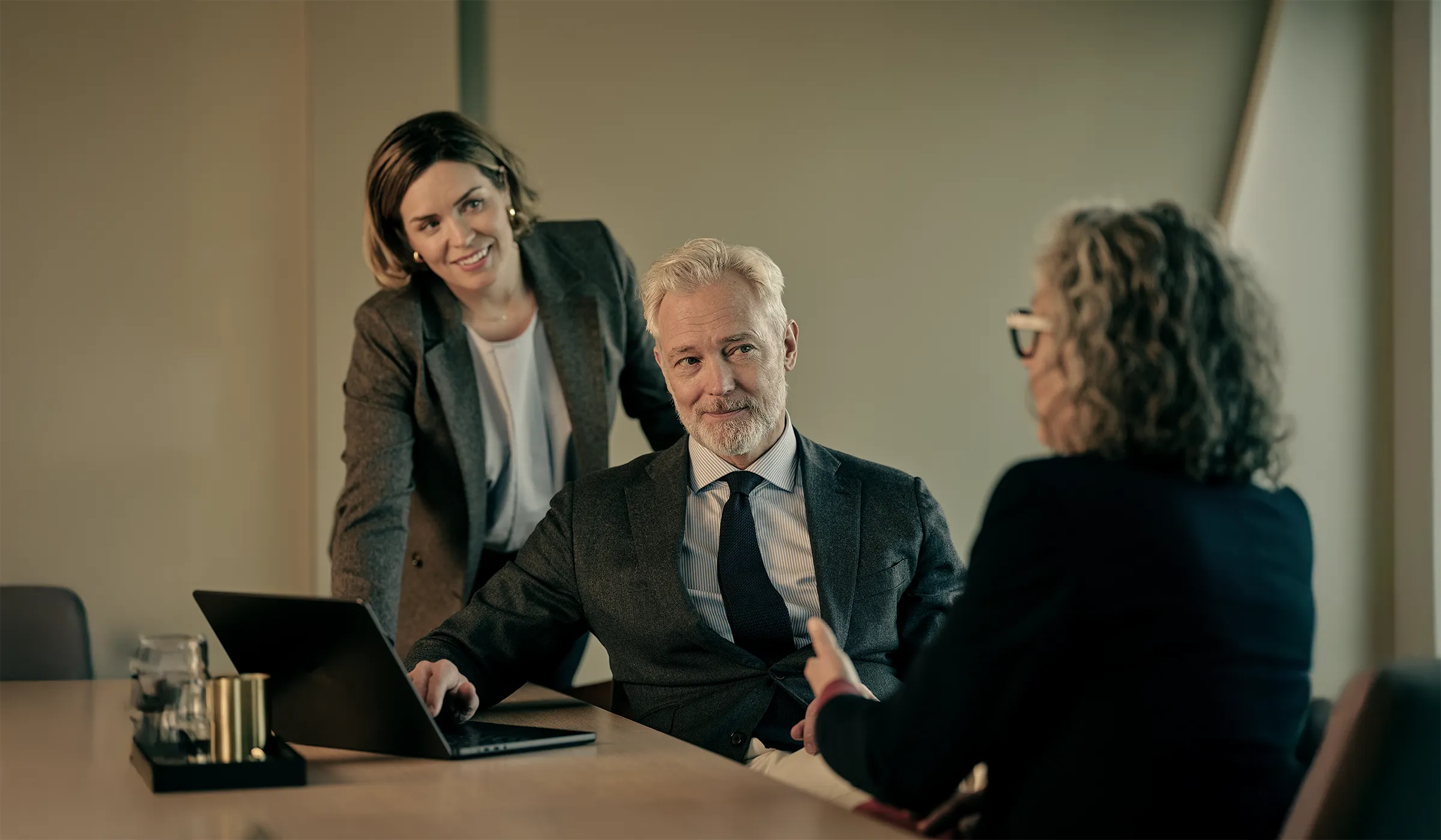 Två kapitalförvaltare i rådgivande möte med kund, Consensus Asset Management