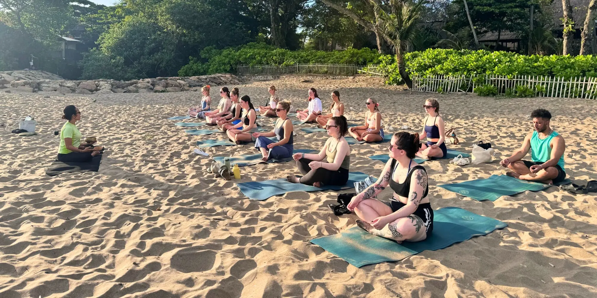 Group yoga on a beach in Bali