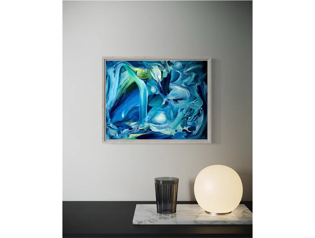 A framed "Blue Matter" painting hangs above a dark console with a marble tray, black glass, and glowing spherical lamp.