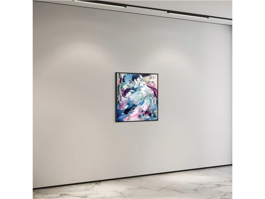 Framed abstract in purples and blues under spotlights in a minimalist gallery.