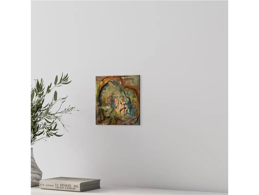 Minimalist interior with a small abstract painting titled "Home is Where the Heart is" hanging above a table with books.