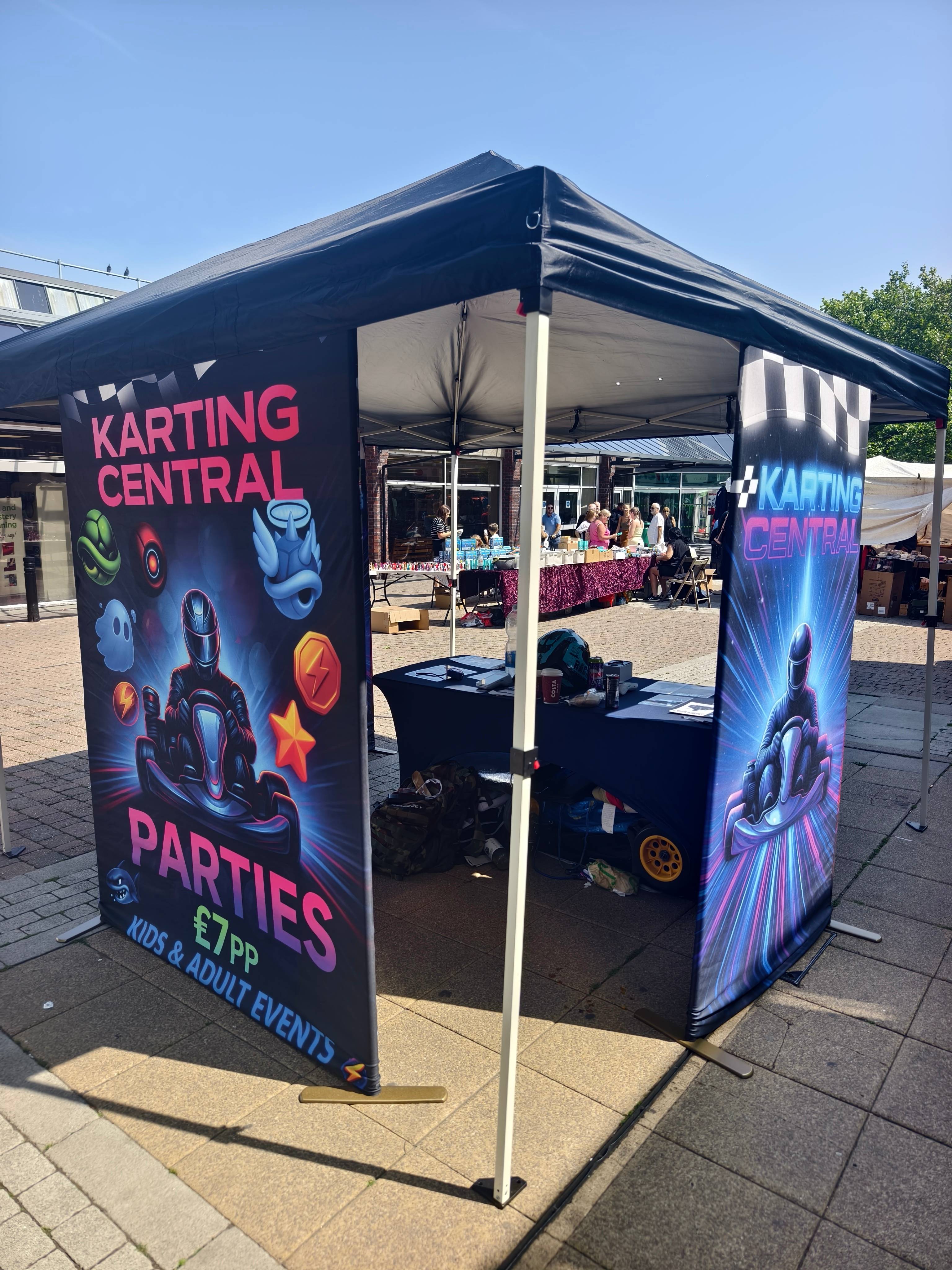 Promoters engaging customers at a branded karting stand