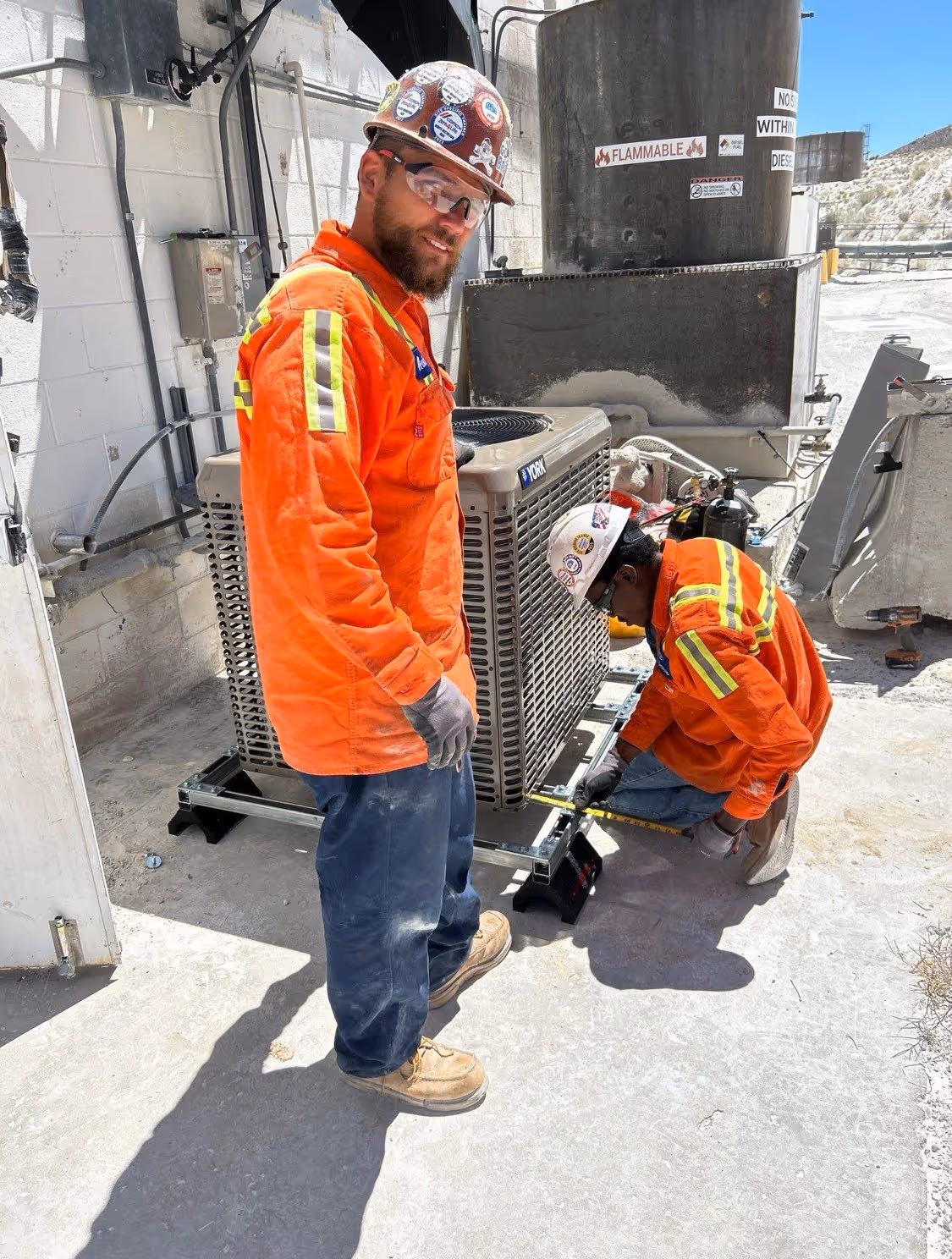 HVAC workers on commercial building
