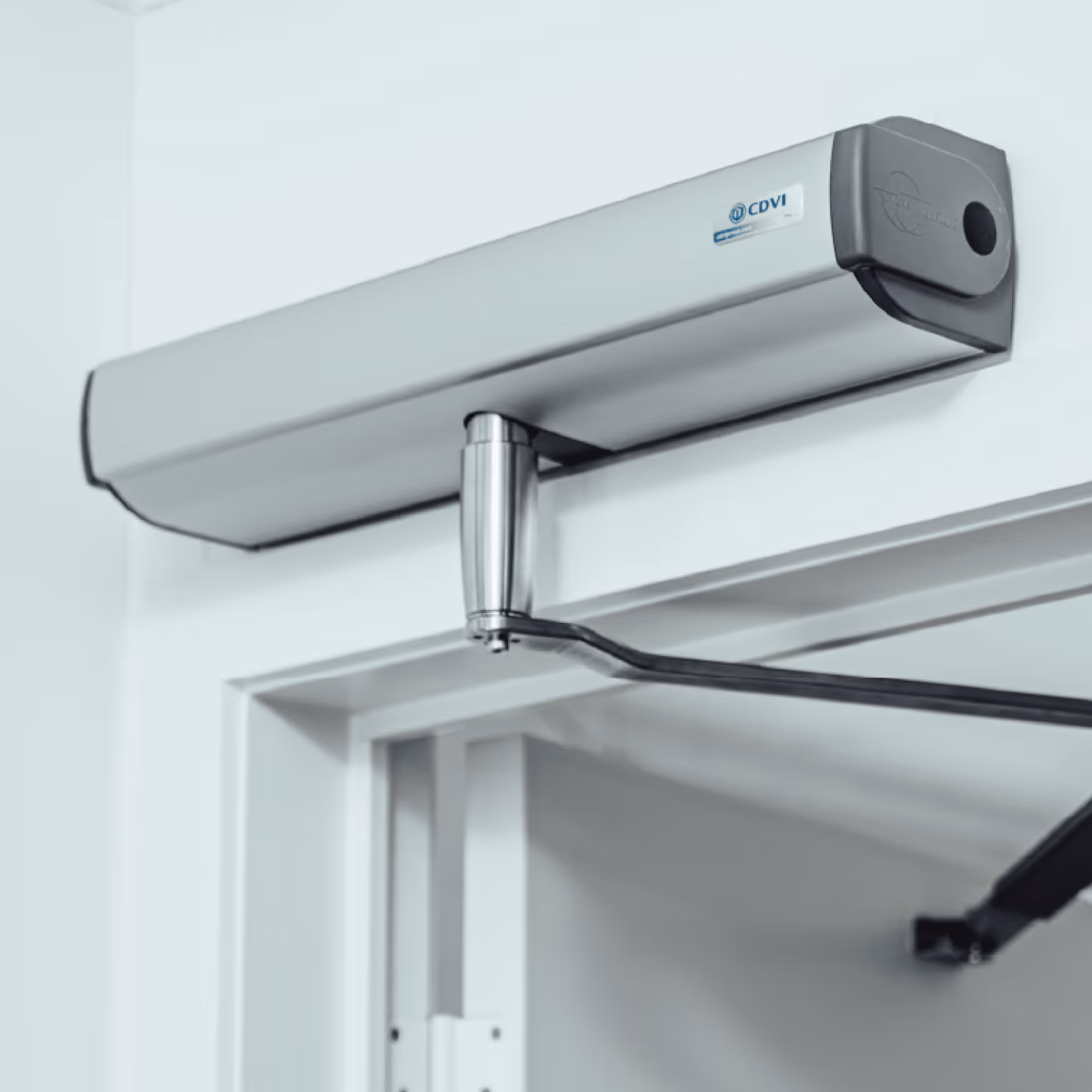 Automatic sliding doors opening, with clear glass panels and smooth operation to provide barrier-free access for mobility devices and improved accessibility.