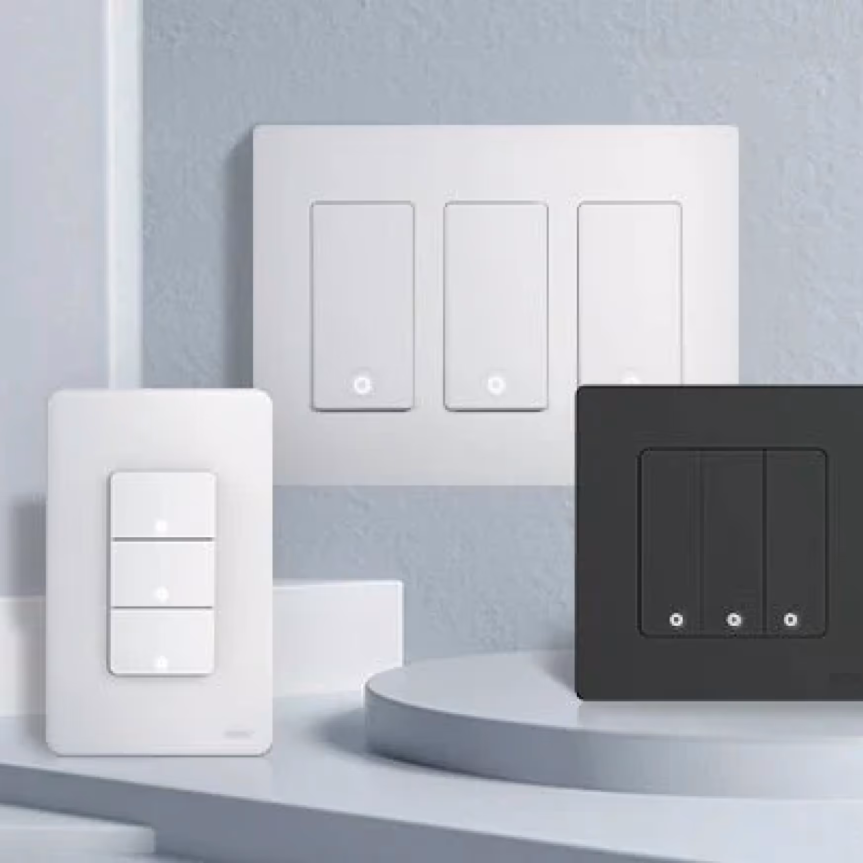 Modern smart light switches on a wall, with touch panels and digital control features to enable accessible lighting control via automation or voice commands.