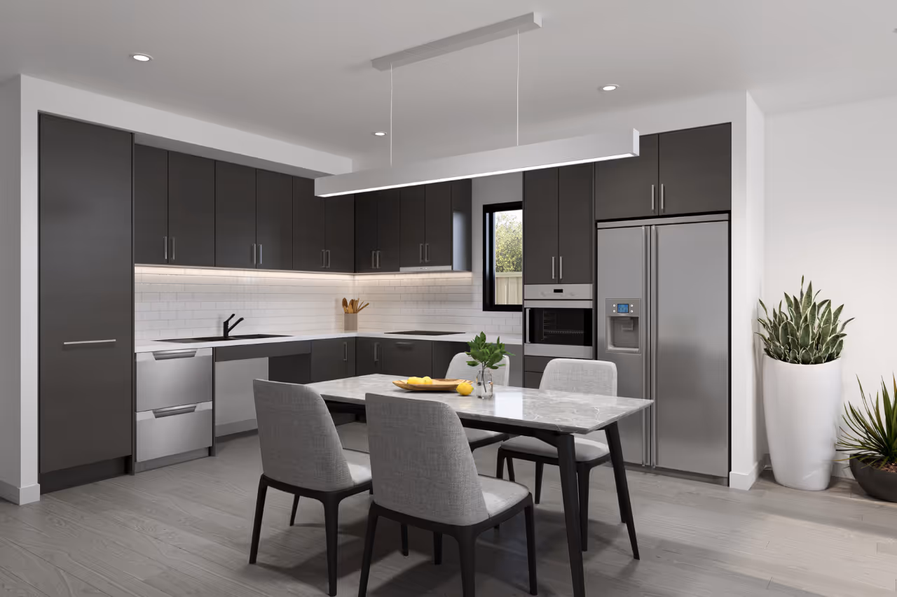 A contemporary kitchen and dining area with an open plan layout: a central dining table, modern cabinetry, pendant lighting overhead, and wide clear floor space for mobility access.