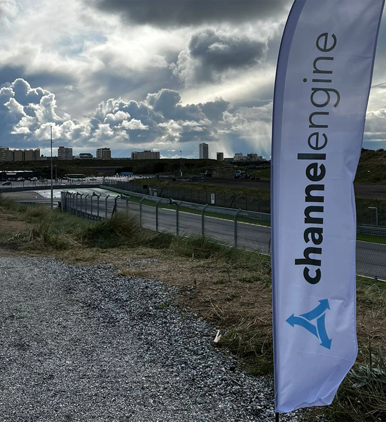 A behind-the-scenes photo shows a camerawoman adjusting a microphone on a man sitting and reading a script