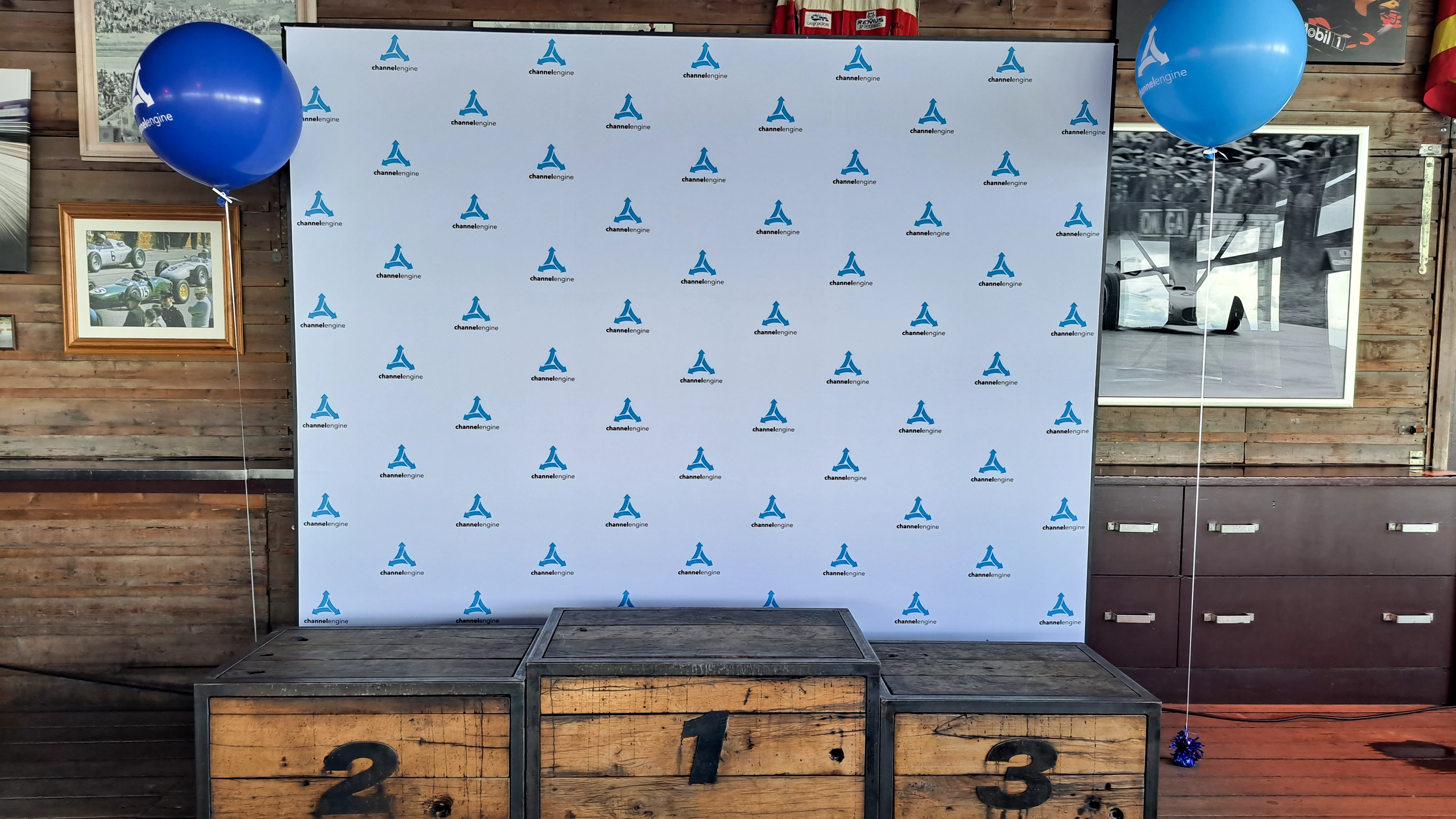 A behind-the-scenes photo shows a woman in a showroom browsing through clothes while another woman films her