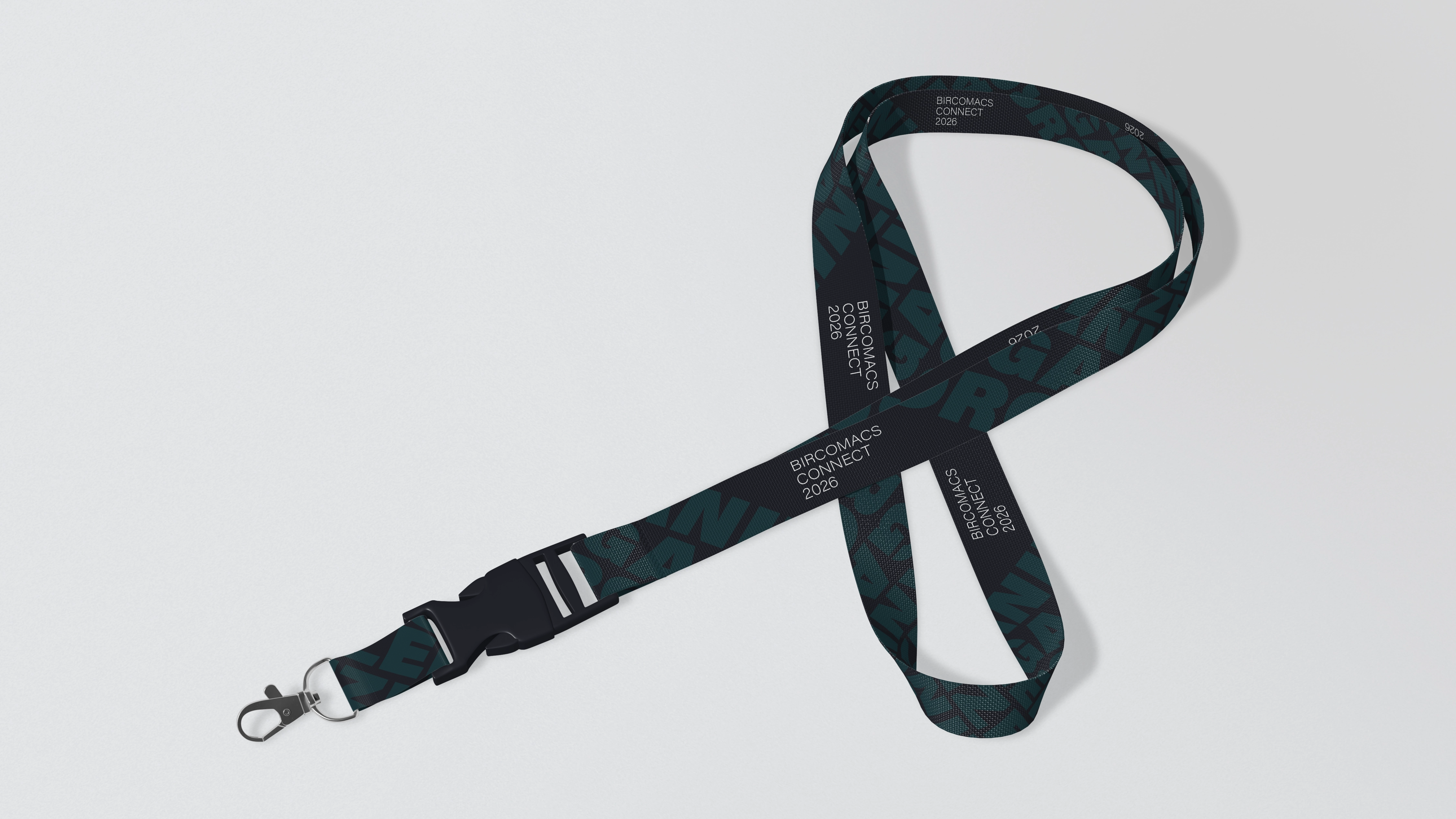 Image showcasing a scene from a video shoot through the lens of a camera. Two women and one man are looking at a magazine on the table, while the rest of the image is blurred