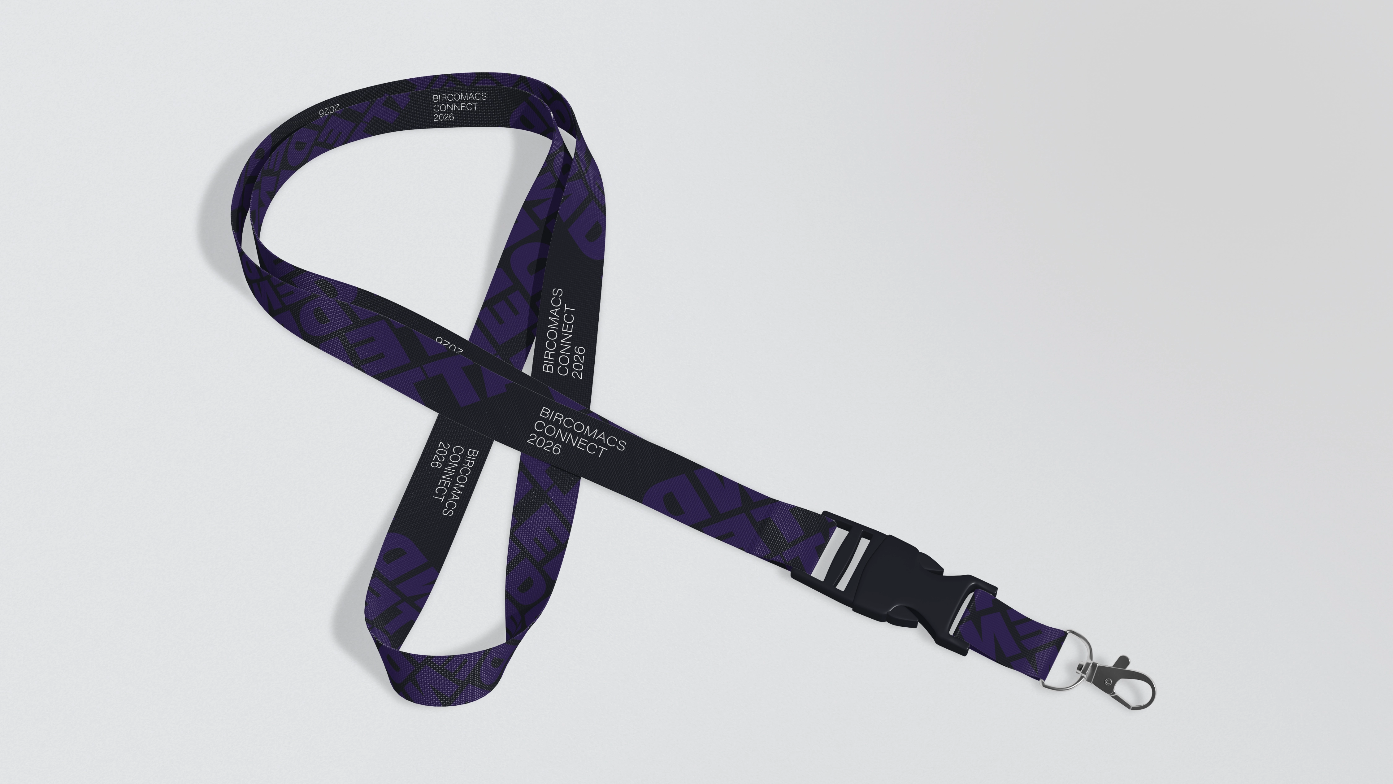 Image showcasing a scene from a video shoot through the lens of a camera. Two women and one man are looking at a magazine on the table, while the rest of the image is blurred