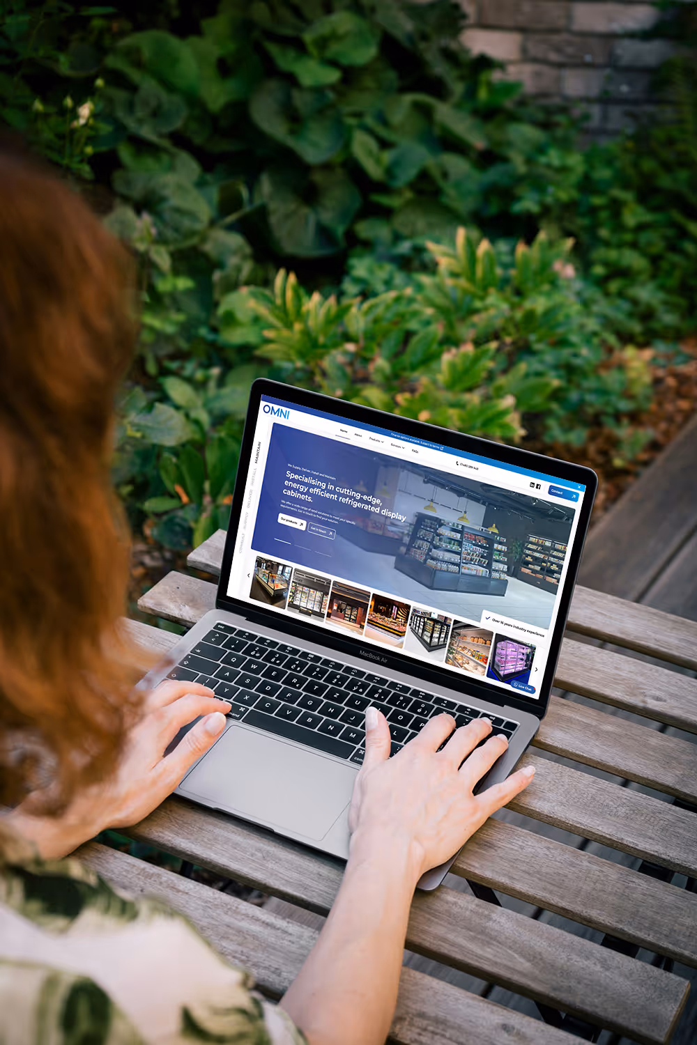 An image of a professional website, displayed on a laptop in an outdoor garden setting, made by Martin Digital 