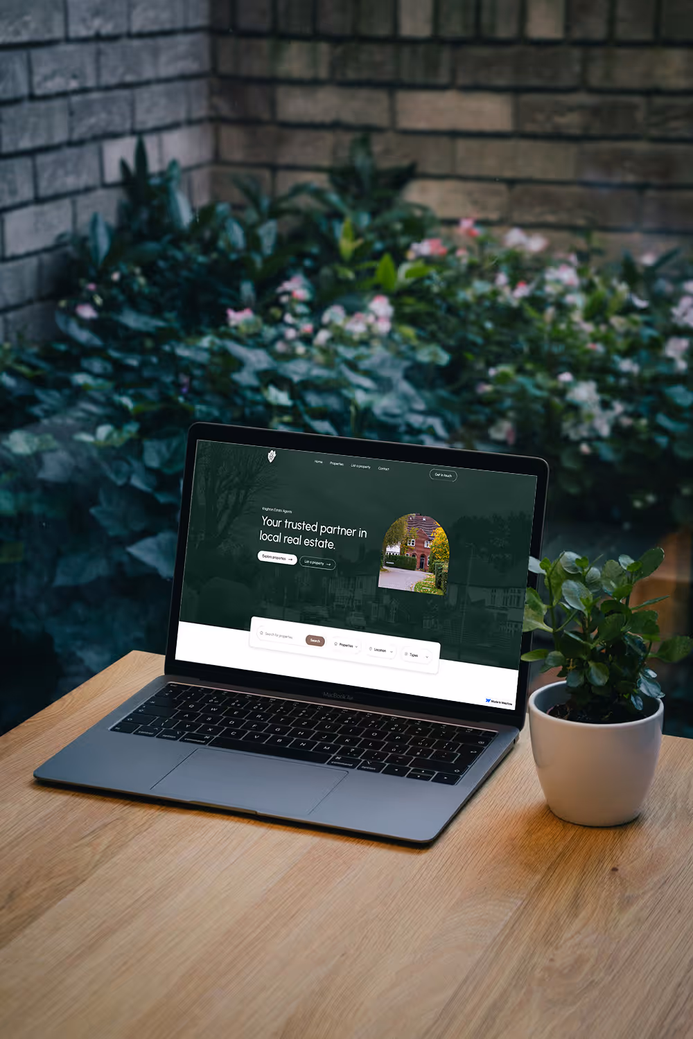An image of a custom, high quality website, displayed on a laptop in an outdoor setting, developed by Martin Digital 