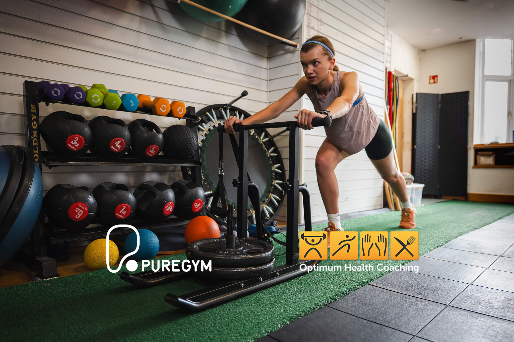 Women pushing sled in Chester gym