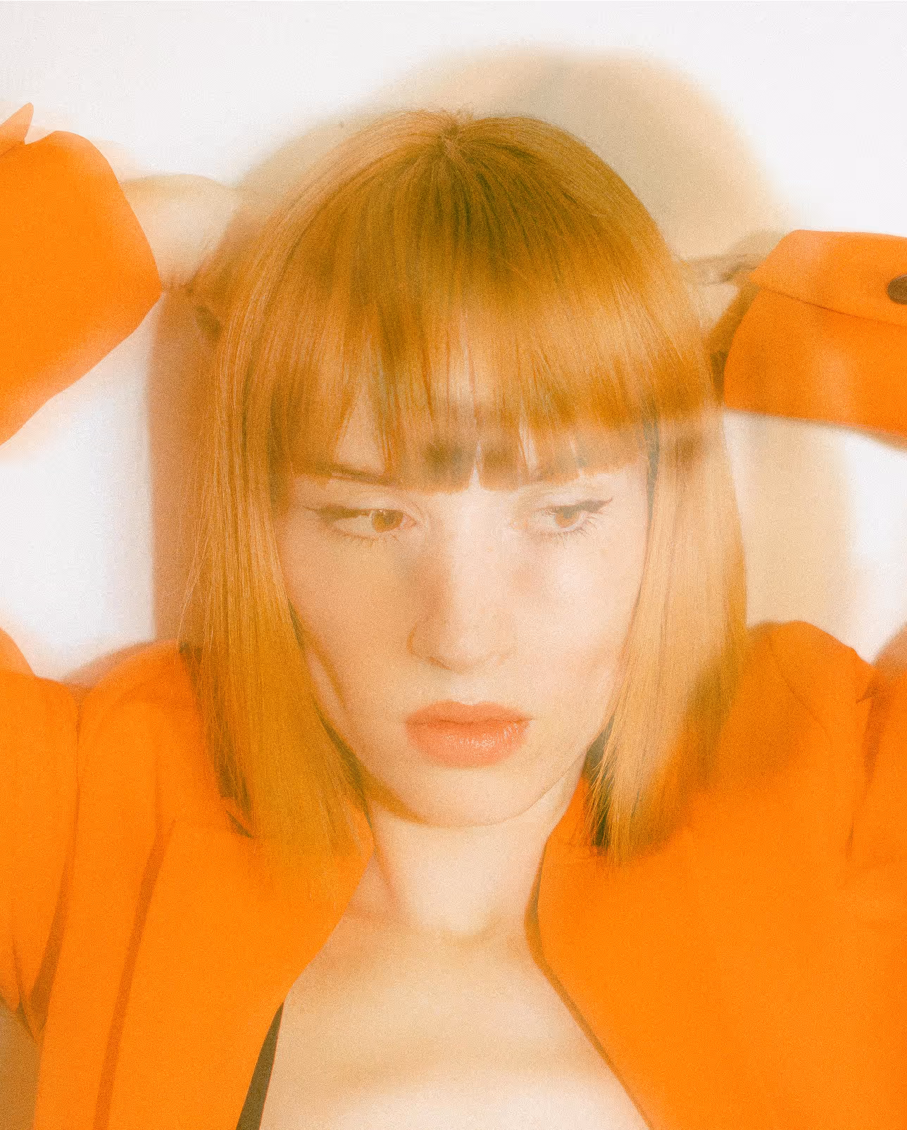 Out of focus picture of red haired lady 