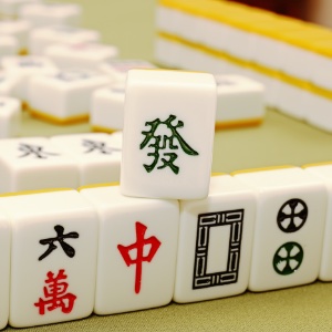 A collection of Mahjong tiles stacked on a table