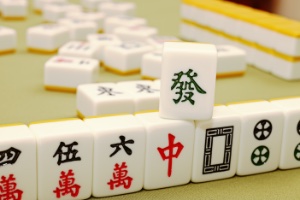 A collection of Mahjong tiles stacked on a table