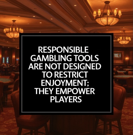 Set in a casino, a black sign with white text on it saying RESPONSIBLE GAMBLING TOOLS ARE NOT DESIGNED TO RESTRICT ENJOYMENT; THEY EMPOWER PLAYERS
