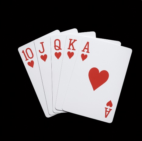 A black background with 5 cards of the same suit (hearts) from 10 to Ace
