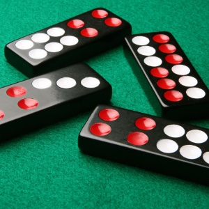 An image of Pai Gow dominos on a green felt background