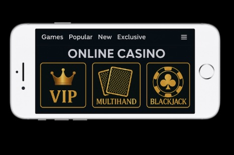 An image of a silver mobile phone on a black background, on the moble screen is an online casino blackjack page with a variety of game options