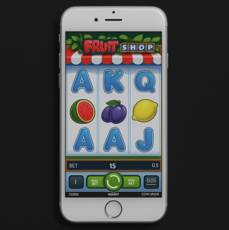 An image of a silver mobile phone on a black background, on the screen is an online slot game similar to FRUIT SHOP