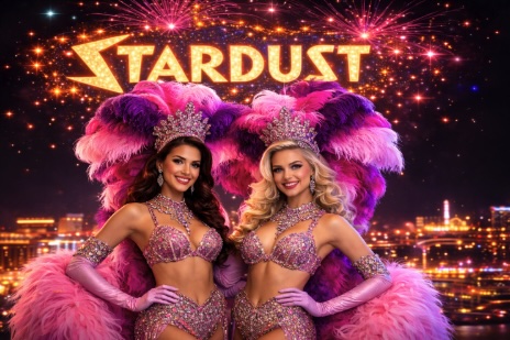 An image of STARDUST styled Showgirls with pink and purple feathers with a Vegas style background