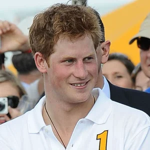 An image of Prince Harry smiling at a polo event