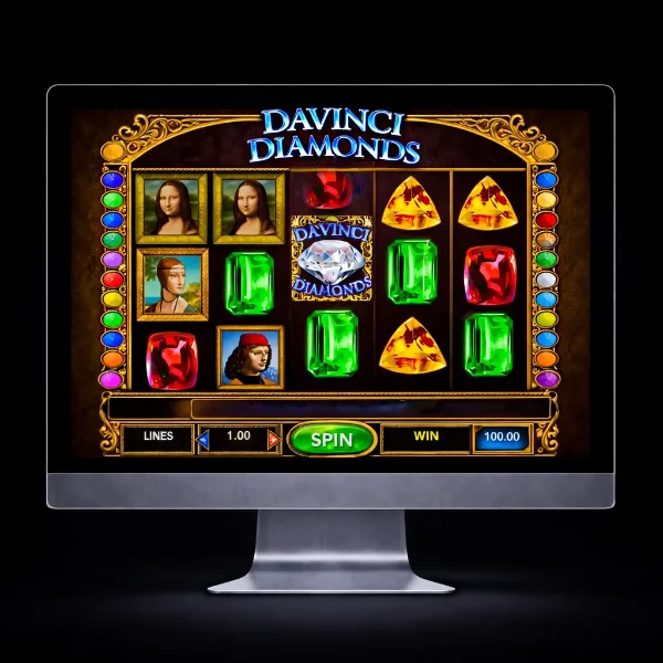 An image of a silver mac monitor on a black background with a DAVINCE DIAMONDS themed online slot game image on the screen