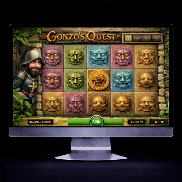 An image of a silver mac monitor on a black background with a GONZO'S QUEST themed online slot game image on the screen