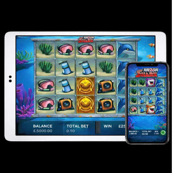 An image of a silver ipad and mobile phone on a black background, on both screens are RAZOR SHARK themed online slot game images