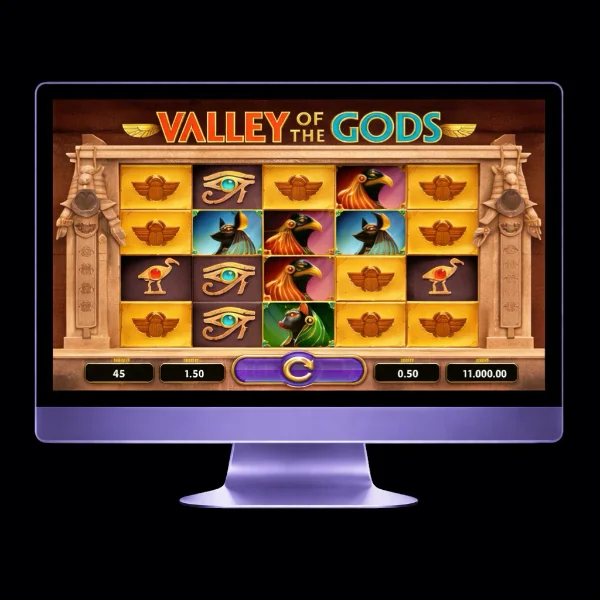 An image of a silver mac monitor on a black background with a VALLEY OF THE GODS themed online slot game image on the screen