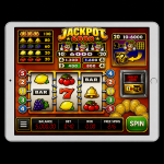 An image of a silver ipad on a black background, on the screen is an online slot game image of JACKPOT 6000