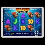 An image of a silver ipad on a black background, on the screen is an online slot game image of BIG BASS BONANZA