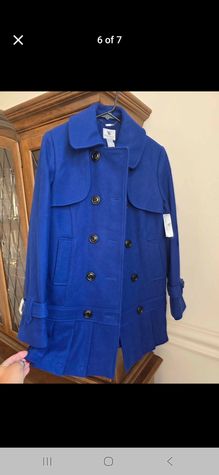 Elegant dress peacoat is  new with tags, never worn.  The color-Shocking Blue"