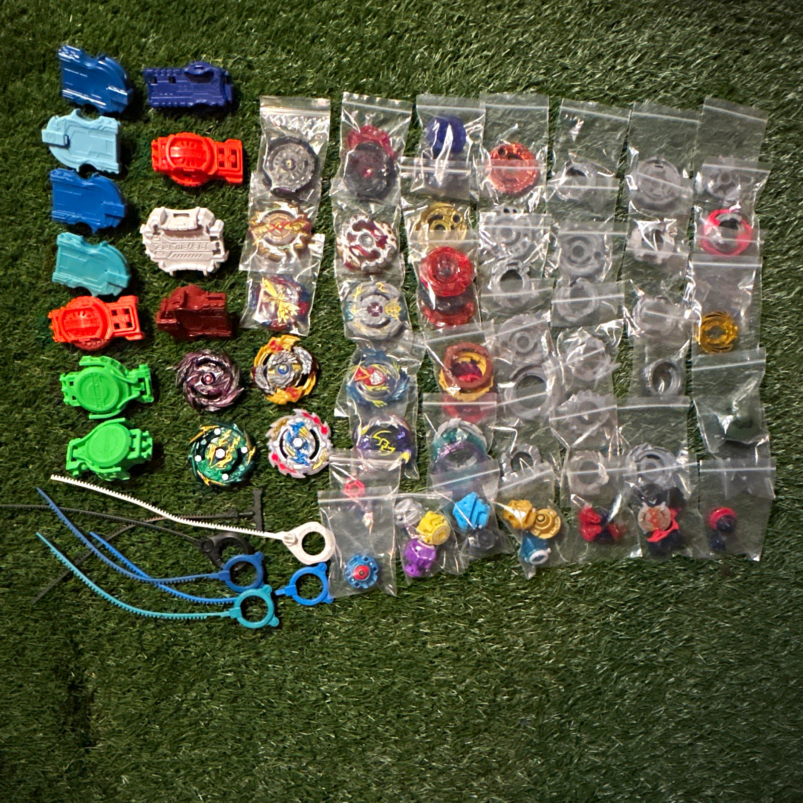 ⁠Lot of 106 Beyblade Burst Mixed Tops Launchers Parts & Accessories Hasbro