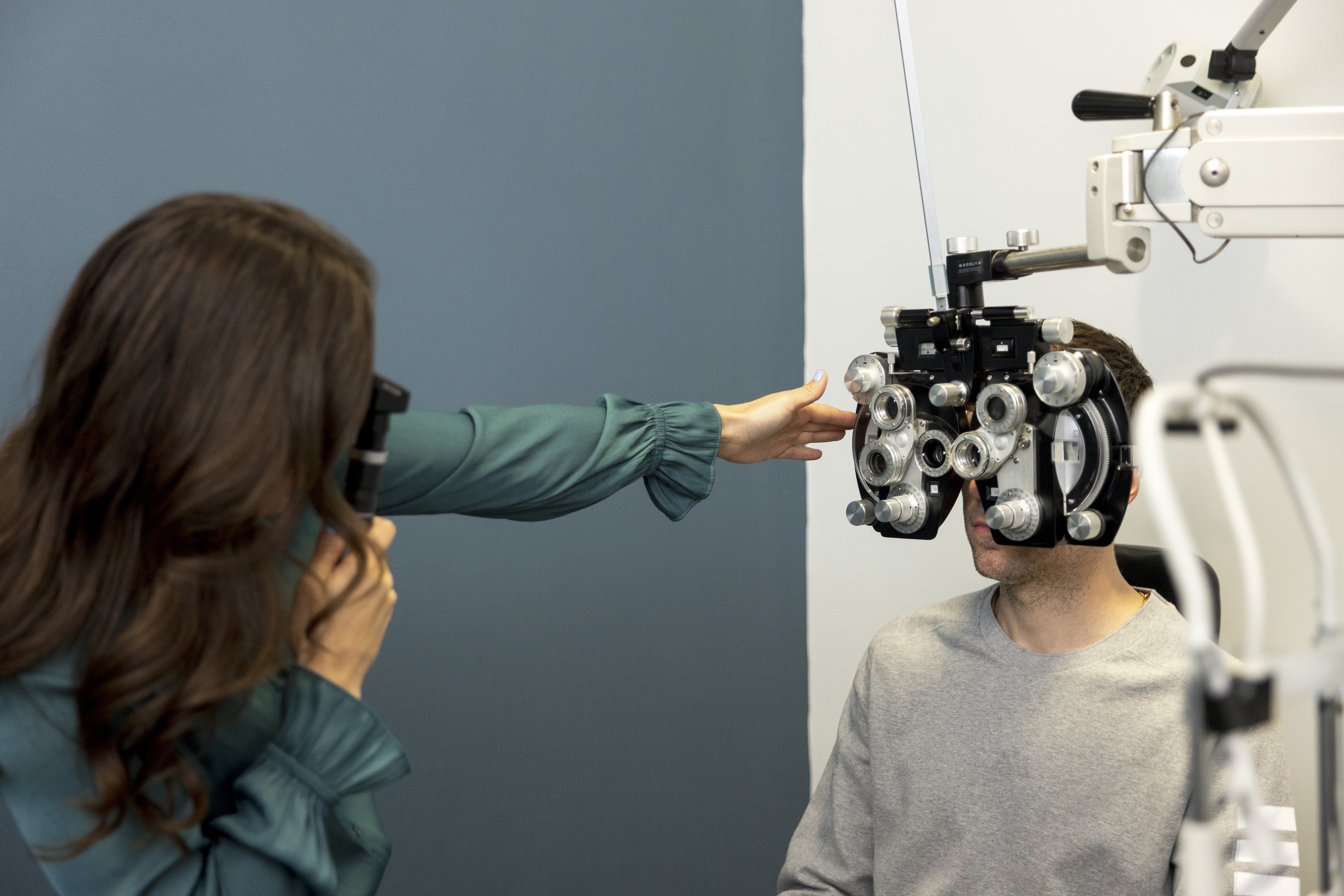 Dr. CJ Murzynski helping a patient.