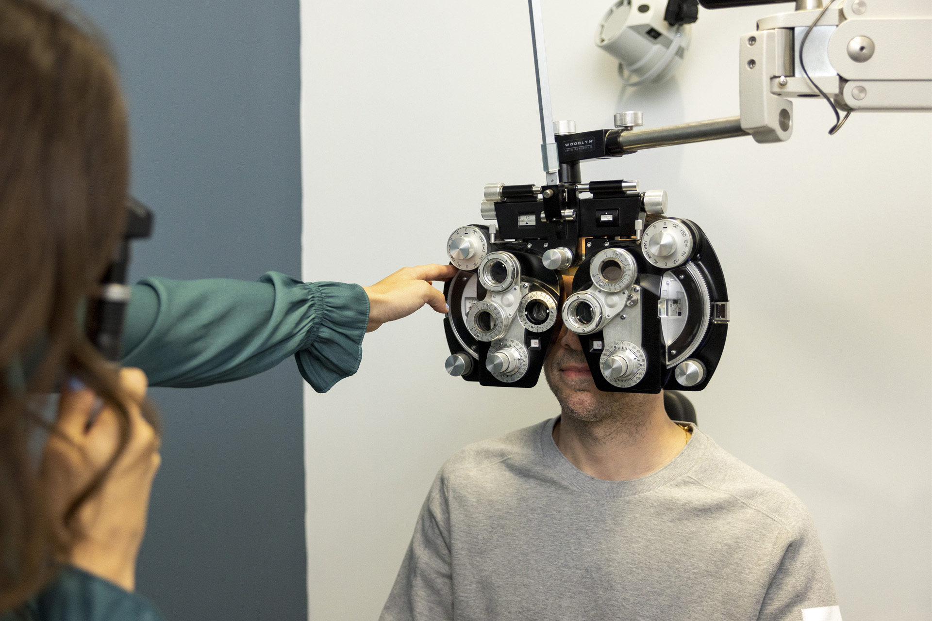 Dr. CJ Murzynski helping a patient.