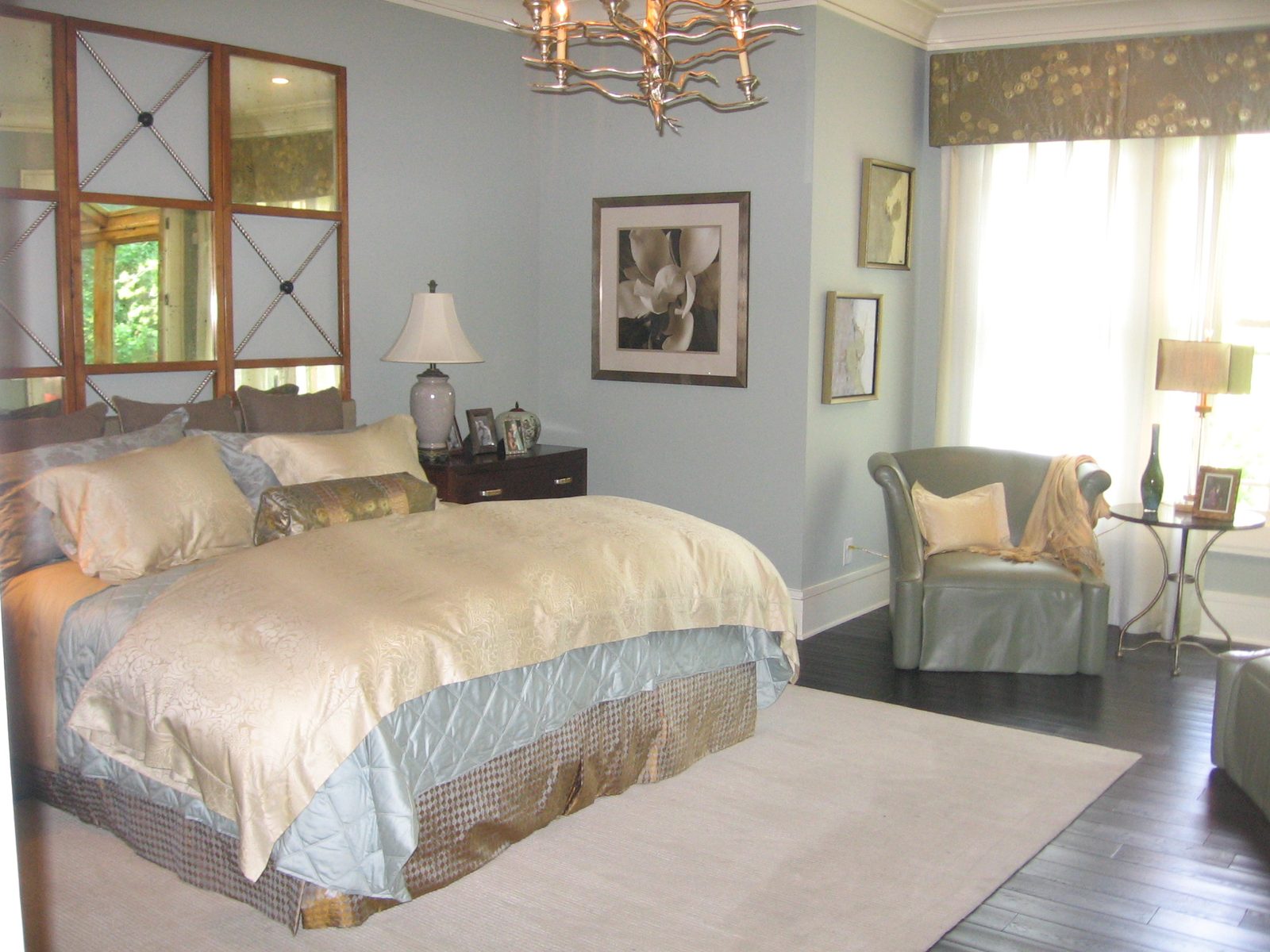 Master bedroom with a sitting area by the windows