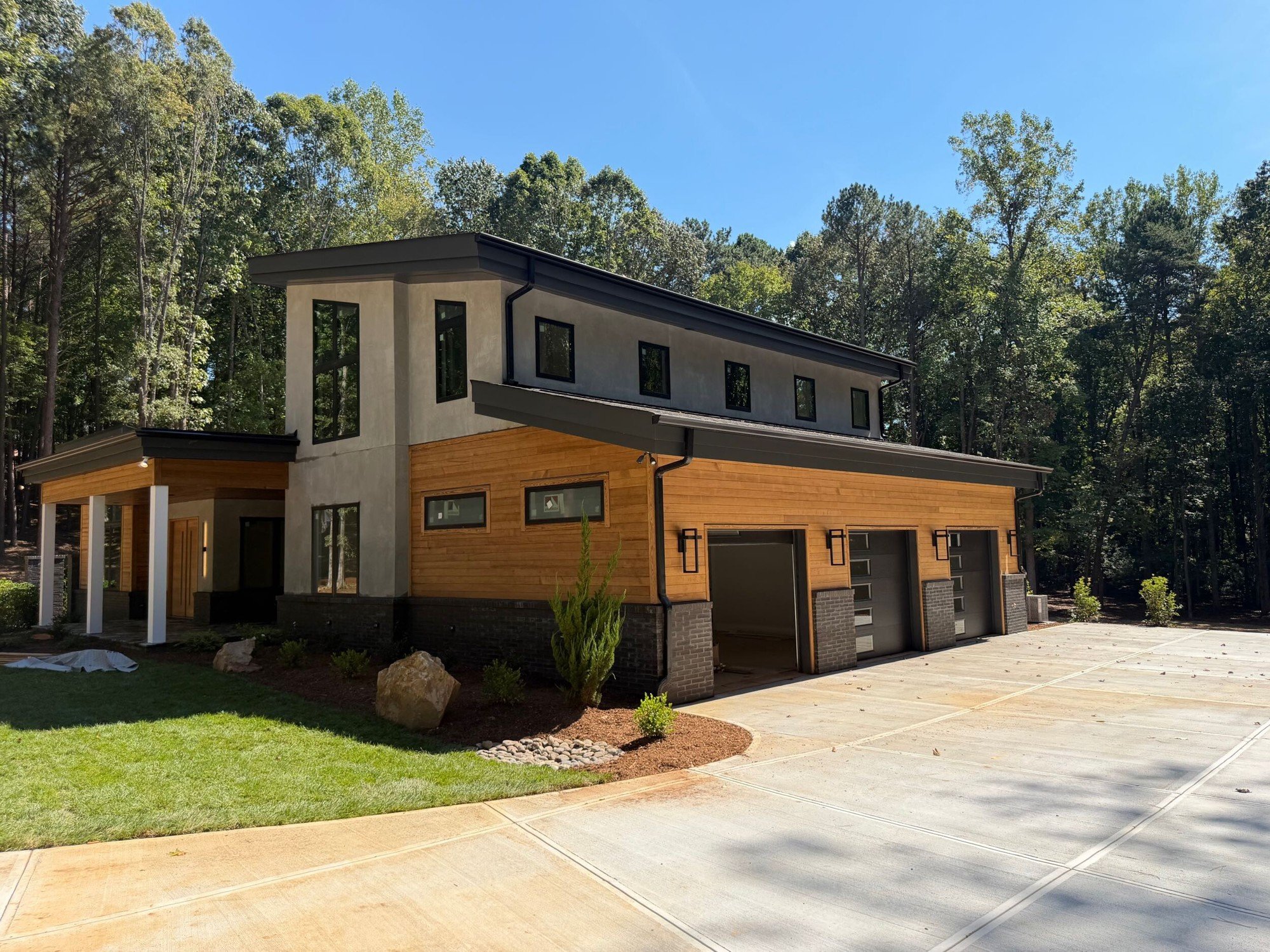 Landscaping goes in at a contemporary home in Charlotte