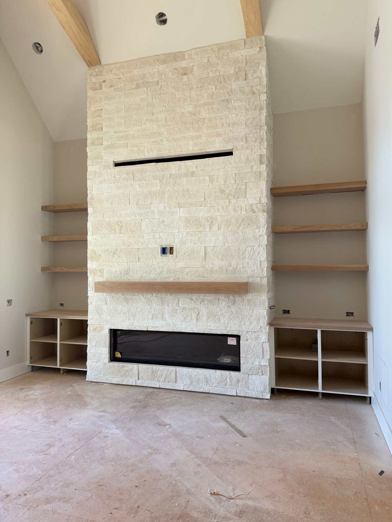 A stone fireplace goes up in McLean
